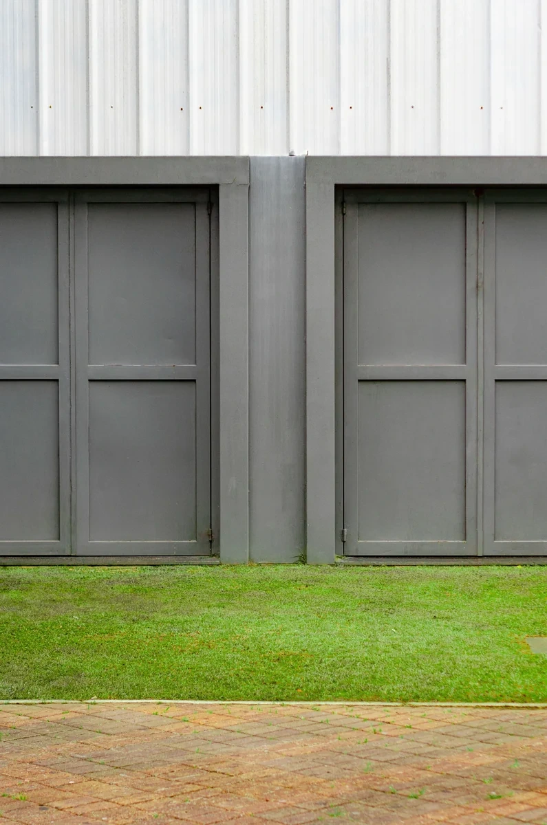 Close view of grey garage door panels and architectural detailing